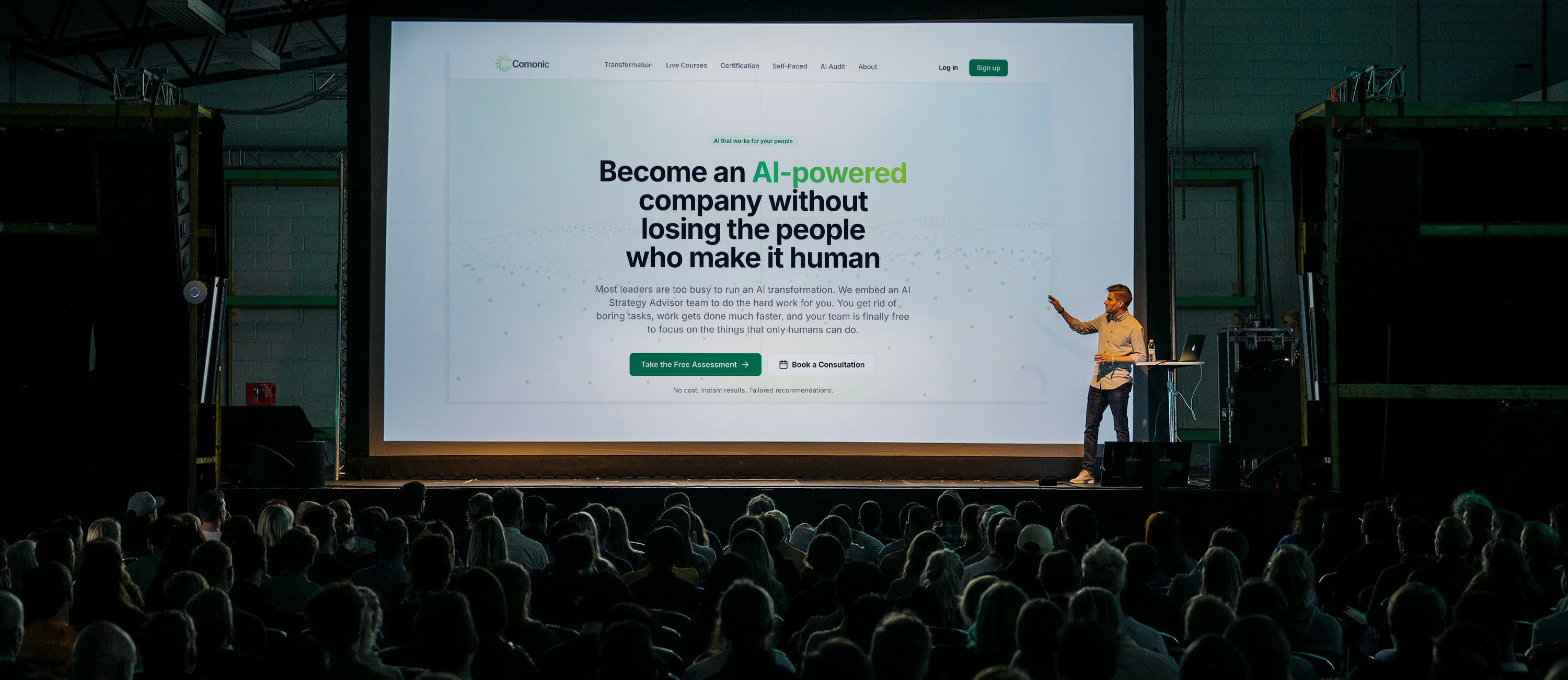 Comonic founder Cesar Contreras presenting on stage to a live audience
